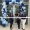 people posing in front of a ribbon cutting