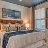 a bedroom with a bed and two nightstands