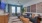 a living room with a couch, tables and chairs