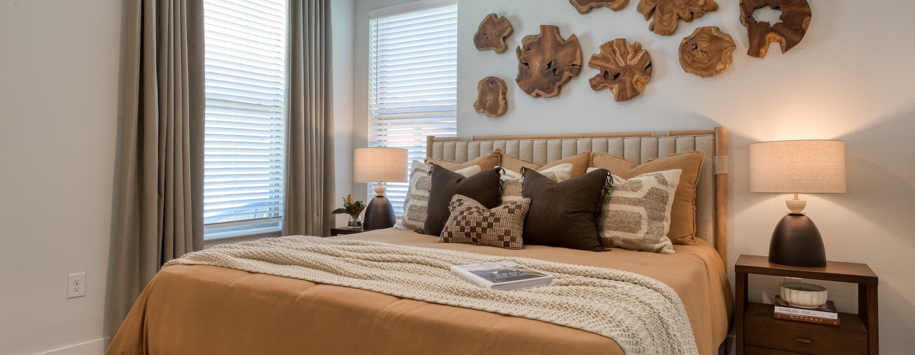 a bedroom with a bed and two nightstands