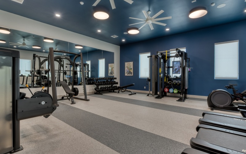 Gym with weight training equipment at Alta Westover Hills apartments for rent in San Antonio, Texas.