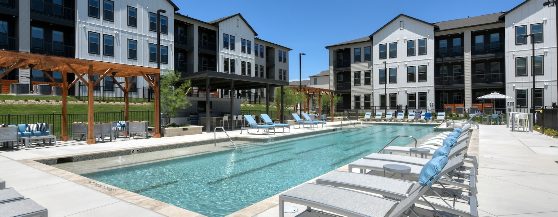 a swimming pool with chairs